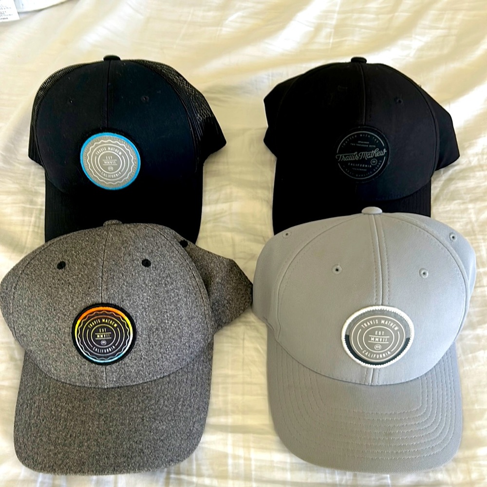 Set of 4 gently used Travis Mathew hats.
